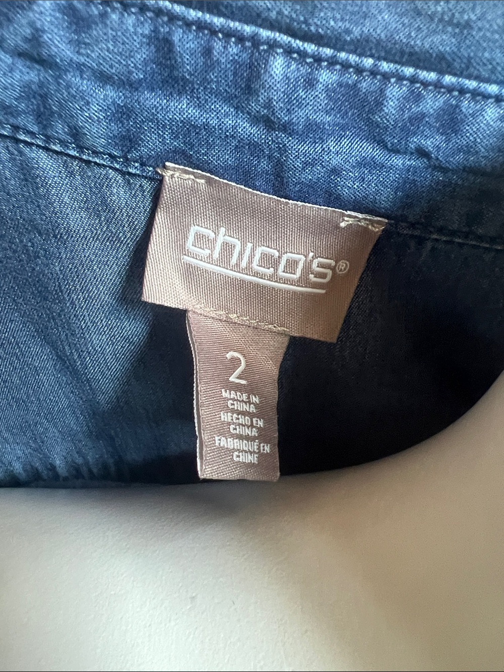 Chico's Sleeveless Chambray Button-Down Shirt in Denim Blue with fringed accents - Picture 2 of 7
